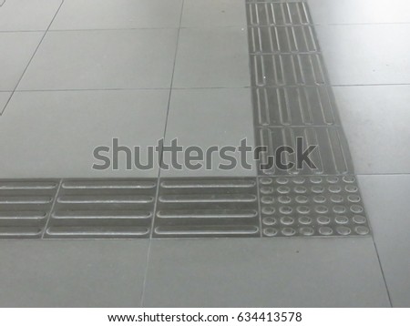 Closeup on indoor tactile paving foot path for the blind and vision impaired handicap in Kuala Lumpur