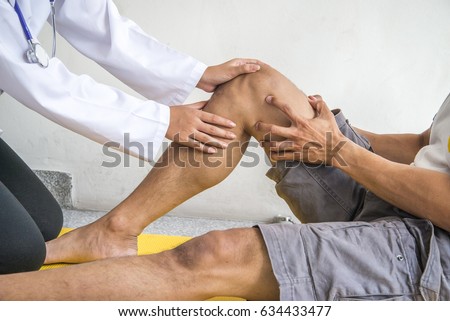 Physiotherapist Giving Exercise In Clinic Royalty-Free Stock Photo #634433477