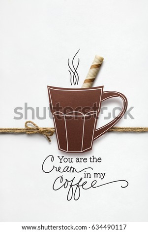Creative concept photo of a cup of coffee made of paper on white background.