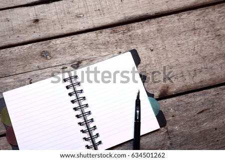 Empty Notepad on wooden background 