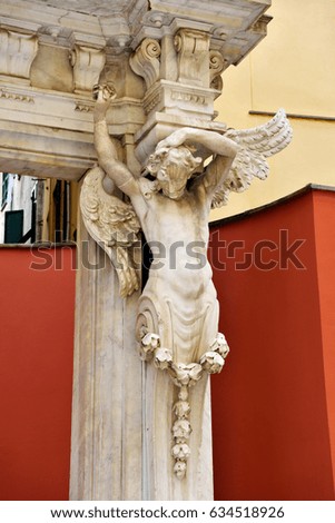 Statues in the courtyard outside of red palace Genoa Italy
