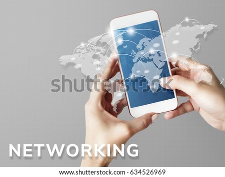 Hands working on digital device network graphic