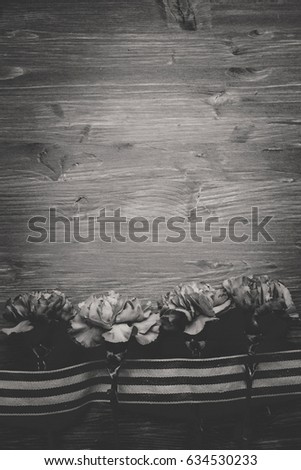 background, card, Wallpaper for the holiday victory Day may 9: cloves, cap and St. George ribbon. Suitable for your labels, layout and design. Black-and-white image..