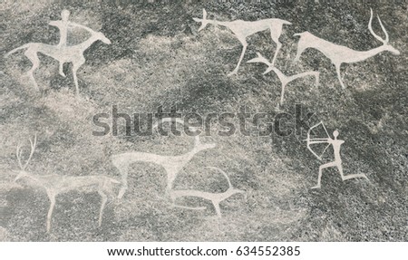 ocher paint. hunters hunt deer.cave paintings of primitive man. 