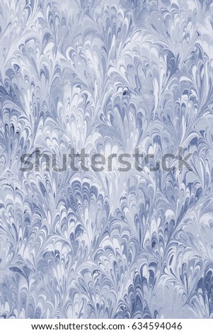 Liquid marbling art pattern on paper background.
