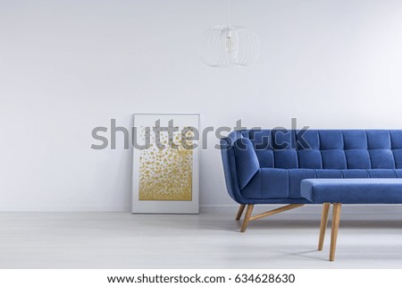 Golden and blue additions in empty white apartment