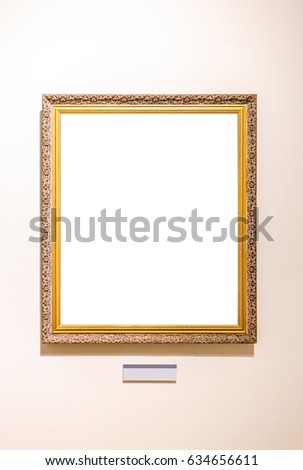 Antique golden frame hanging on the wall