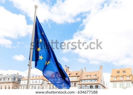 European Union flag with French buildings in the background