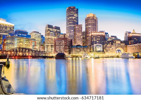 The Boston skyline at night, located in Fan Pier Park, Boston, Massachusetts, USA.