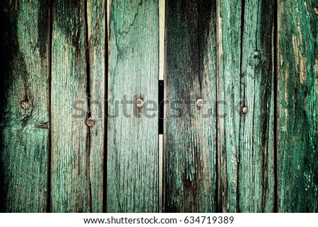 Wall texture background with peeling old paint. Old plank wooden wall background.