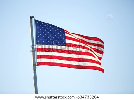 Photo of American flag waving in the wind
