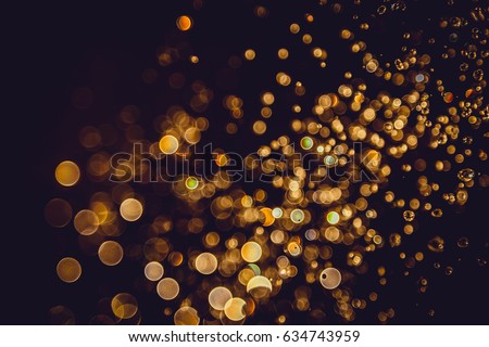 Defocus bokeh glitter gold vintage lights dark background