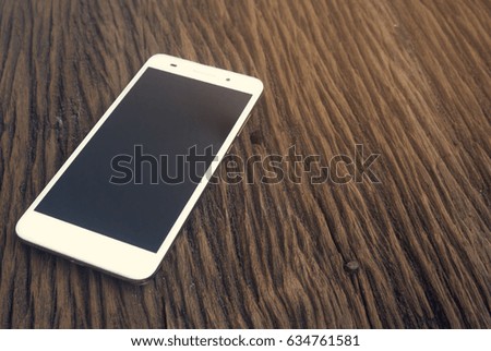 smart phone on wooden ground