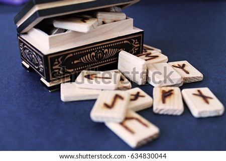 Wooden runes in casket