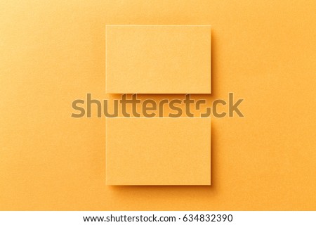 Mockup of two horizontal business cards at golden foil paper background.