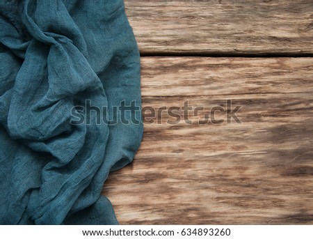 Napkin on a old wooden background - top view