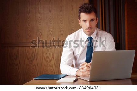  Successful healthy looking good entrepreneur at work with copy space. Stock Photo