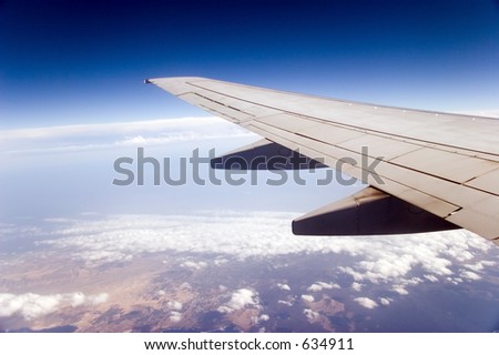 Airplane wing as seen from a passenger's seat