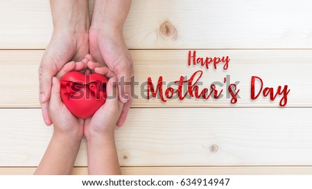 Happy Mother's day and love you Mom holiday greeting card with  woman support kid's hands giving red heart gift  Royalty-Free Stock Photo #634914947
