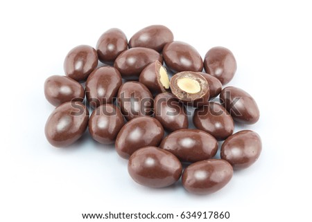 Chocolate covered nut balls in a group isolated on white background