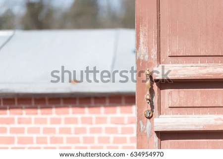 Red door with vintage old lock