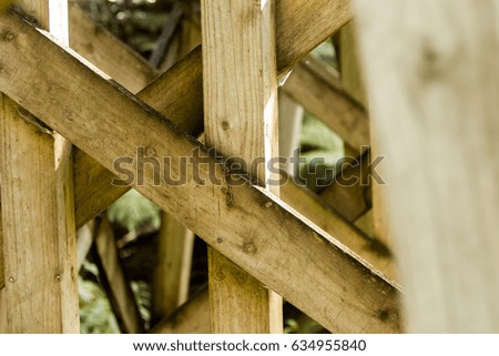 abstract wooden pattern fence construction on natural background
