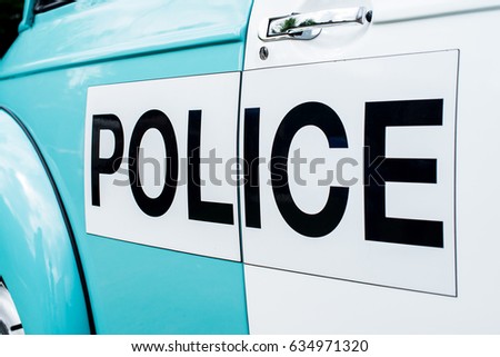 Police Sign On vintage Police Vehicle