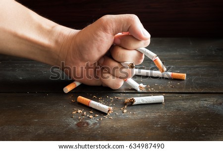 Hand smash for destroy many tobaccos concept no smoke forever.