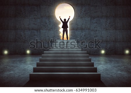 Success businessman cheering on stair against concrete wall with key hole door ,sunrise scene city skyline outdoor view . Royalty-Free Stock Photo #634991003