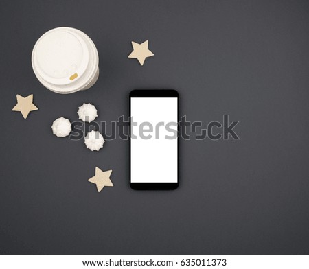 Phone mock up on a gray background table, star and coffee. View from above. Flat lay