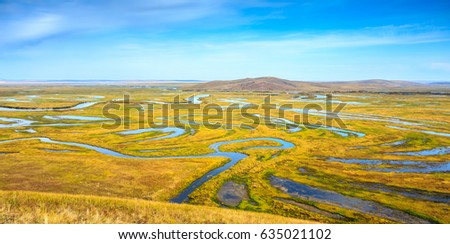 Wetlands and swirl streams in Hulunbeier, North China. Royalty-Free Stock Photo #635021102