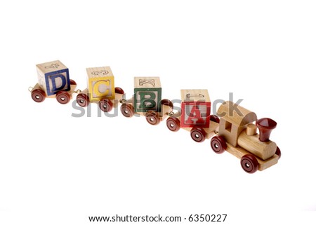 Toy train and learning blocks isolated over white