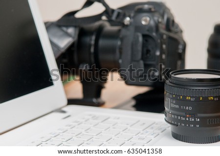 Professional photography editing equipment with camera and laptop
