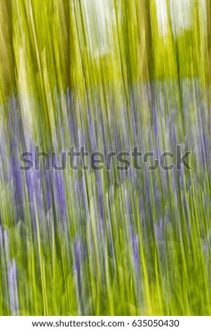 Abstract forest background in green and purple tones, vertical lines