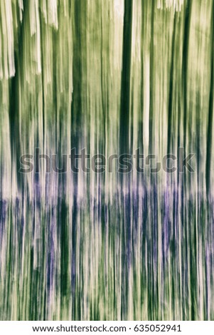 Abstract forest background in green and purple tones. Vertical lines vintage filter applied