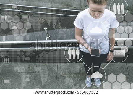 View from above. Young woman standing and using smartphone.In foreground are virtual icons with picture of cloud, people and digital gadgets. Girl blogging, chatting, working, shopping online.