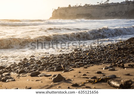 Breaking and crashing waves at Lunada Bay beach at golden hour