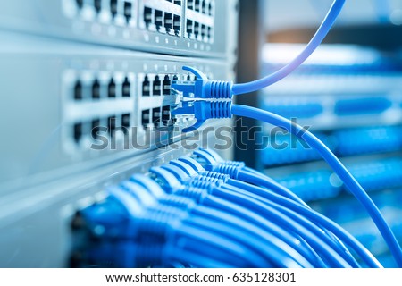 network cables connected to a switch Royalty-Free Stock Photo #635128301