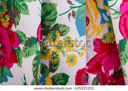 Texture of a fabric in a flower. Close Up of retro tapestry fabric pattern with classical image of the colorful floral ornament. Fragment of colorful retro tapestry textile pattern.