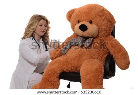 female doctor giving up insulin shot to patient teddy bear. kids play. isolated