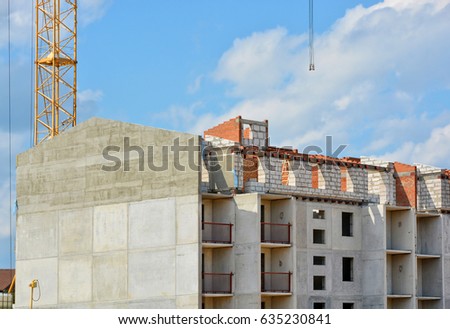 Construction site. Contemporary urban landscape. Nice photo of unfinished building with blue sky in background. Developing of modern civil engineering. Construction industry 