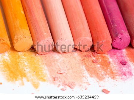Multicolored crayons, pastel. Yellow, pink, red, crimson. Painted Pastels