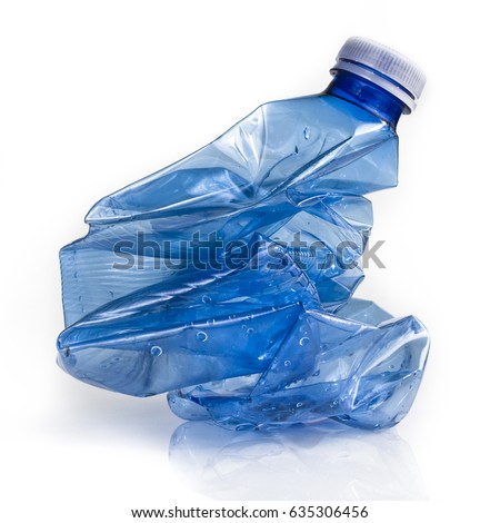 Crushed blue plastic bottle on white background. Still-life picture taken in studio with soft-box.