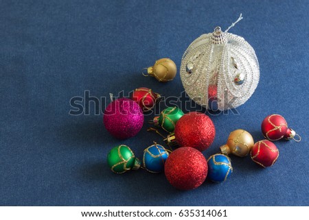 Christmas balls on a denim fabric. Christmas decorations.