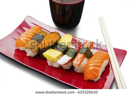 Picture of variety Japanese seafood and chopsticks on the plate, isolated on white background