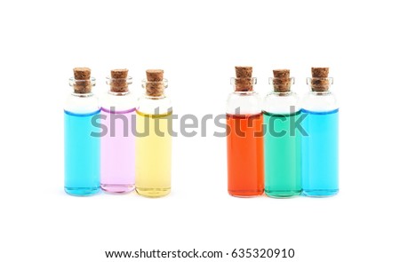 Composition of a few tiny glass vial bottles filled with the colored liquids, composition isolated over the white background, set of two different foreshortenings