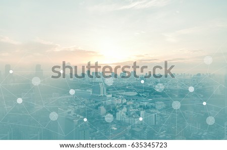 Networking connect technology abstract concept. Polygonal with connecting dots with blur city business background. Royalty-Free Stock Photo #635345723