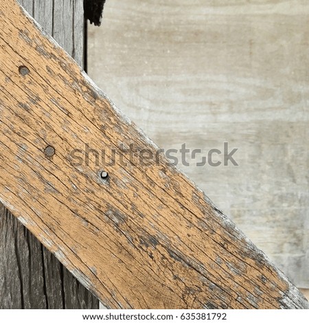 Reusing of old wood to make wood wall, cost saving of making house or garage by reuse the existing materials