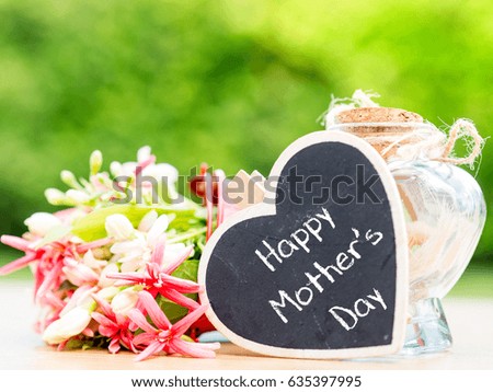 mother's day concept. LOVE MOM alphabet with flower on background
