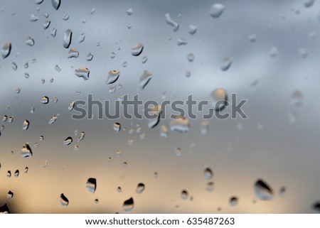 Drop of water on glass, macro photo
